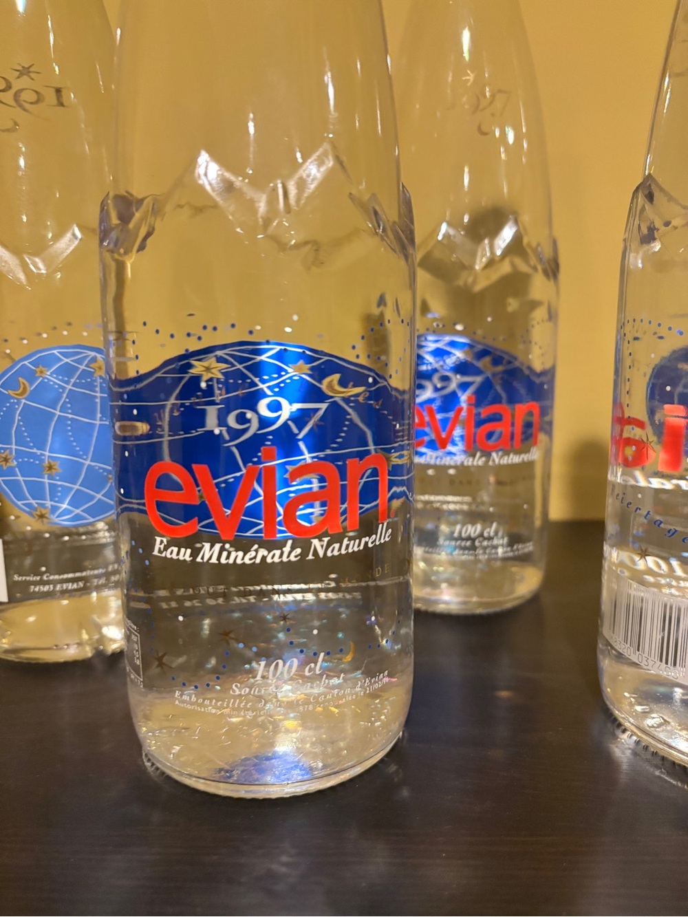 Five Evian Glass Water Bottle with Blue & Red Label